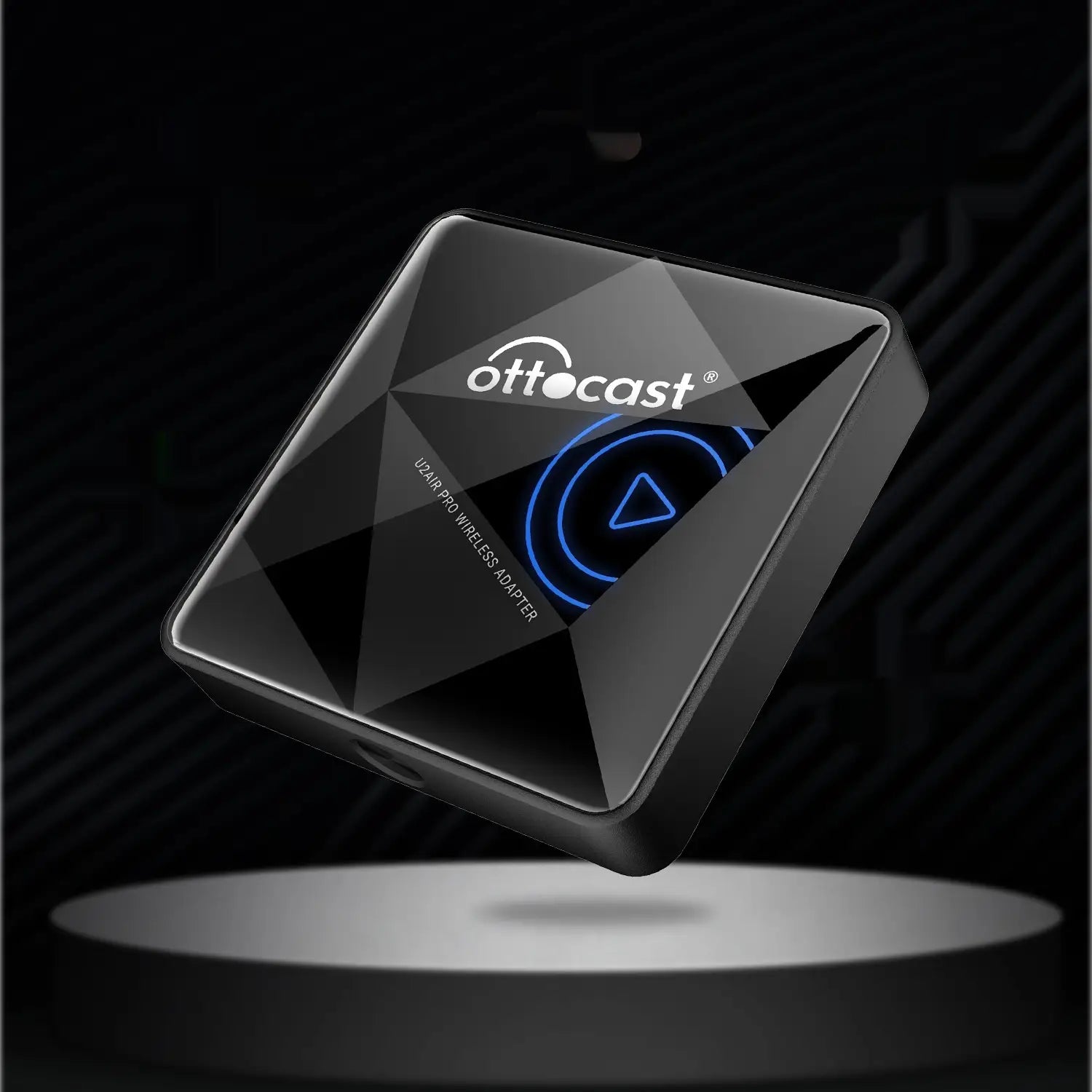 Black matte-finish square-shaped ottocast u240a pro wireless car bluetooth aibox adapter with a glowing blue play button icon for wireless car bluetooth connectivity.