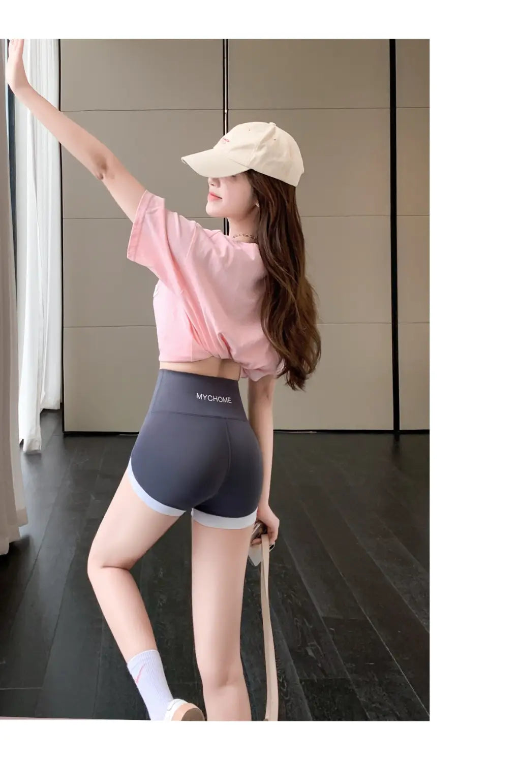 Dark gray high-waisted hip lifting sports shorts with white trim and subtle mychome logo on the waistband designed for comfortable stitching yoga pants activities.