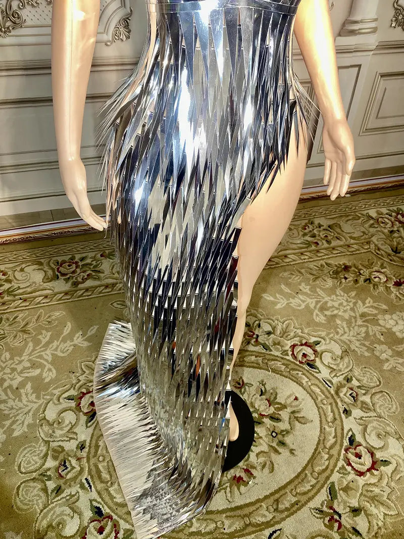 a shimmering silver metallic evening dress with sequins, high slit, and cascading fringe details designed for stage advanced light luxury use