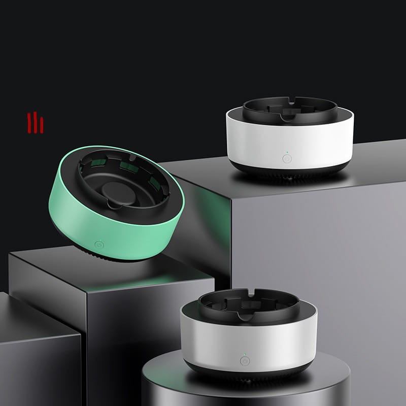 Modern minimalist ashtray in matte mint green plastic housing with black interior designed for smoke removal air purification.