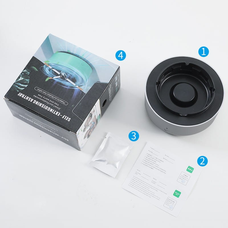 silver and black self-extinguishing ashtray with circular design and central depression for smoke removal air purification in the mint green smoke removal air purification ashtray product line