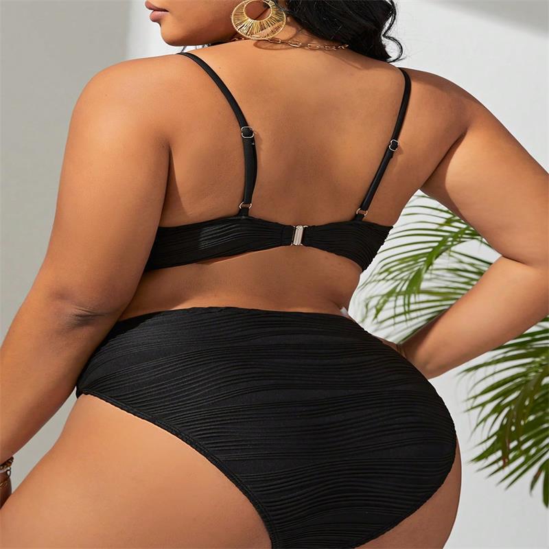 black pleated bikini two-piece set swimsuit featuring thin straps and a silver clasp at the back shown from the rear view
