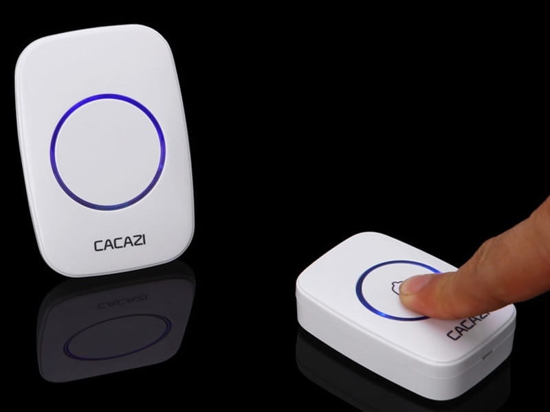 white intelligent exchange doorbell system featuring a white wireless doorbell home unit with a circular blue illuminated button for pager intelligent exchange functionality