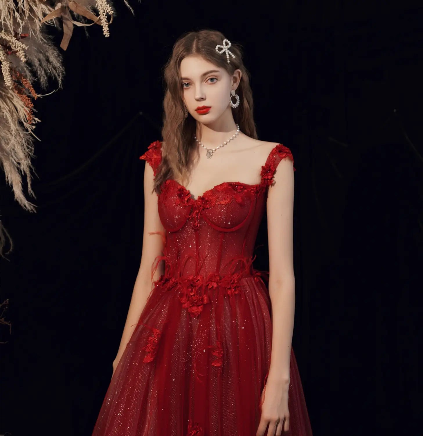 A shimmering red lace wedding toast dress with floral appliqués and a sweetheart neckline perfect for a toast dress host or dress host annual event.