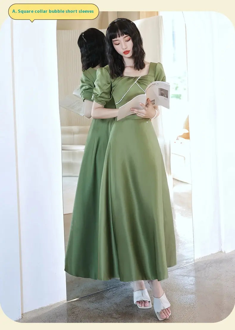 a flowing avocado green sisters group satin midi dress featuring a square collar and puffy short sleeves