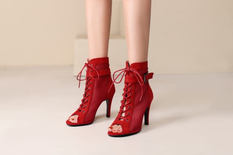 Red suede lace-up ankle boots with a high heel and stylish peep toe hollow mesh design ideal for dance heels.