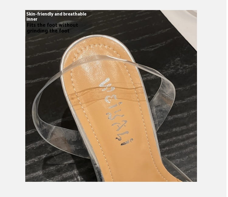 Clear plastic women’s high-heeled sandal with tan insole and stitched detailing for elegant wear.