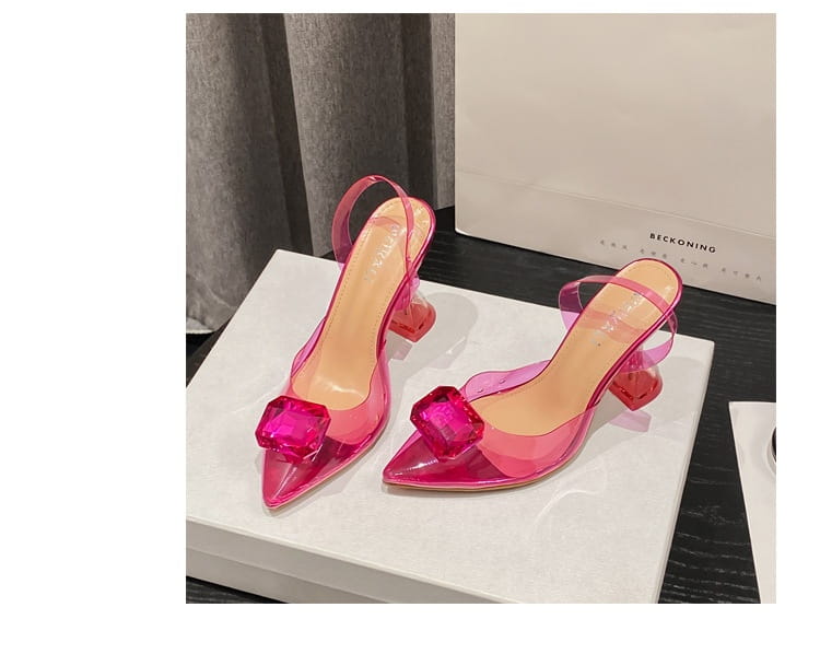 pink satin bow women’s high-heeled sandal featuring transparent pink high-heeled sandal with a bold faceted crystal embellishment at the toe and a matching slingback strap.