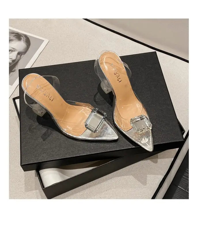 clear acrylic women’s high-heeled sandal with silver metallic finish and prominent square crystal embellishments on the toe