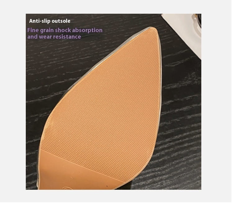 Tan textured anti-slip outsole with fine grain for shock absorption and wear resistance on a pink satin bow women’s high-heeled sandal.
