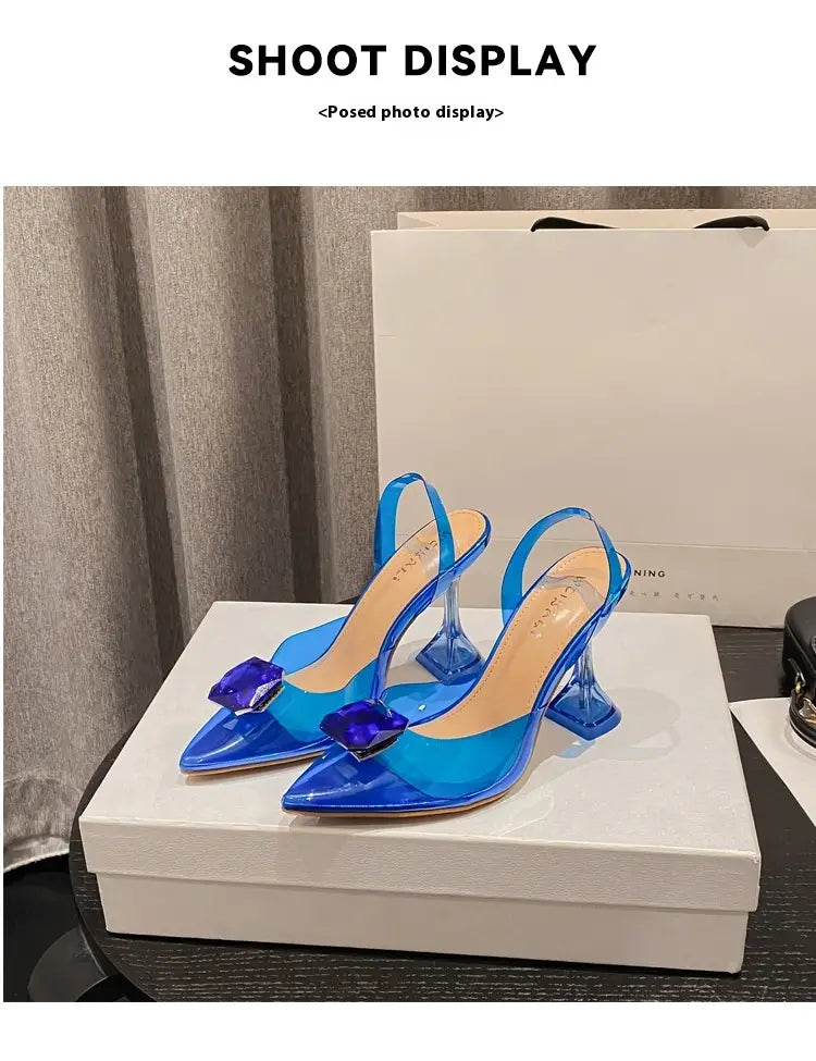 transparent blue women’s high-heeled sandal with a prominent purple gemstone buckle and sleek modern design in the pink satin bow women’s high-heeled sandal collection