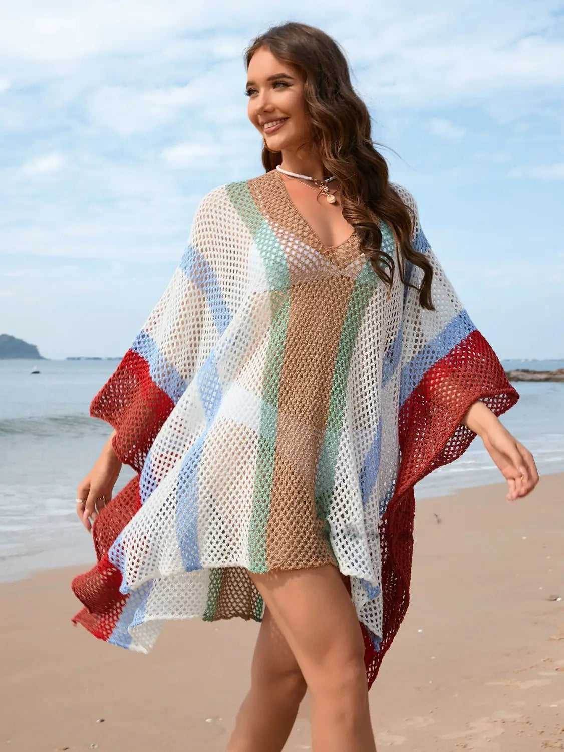 A vibrant multi-colored striped mesh loose plus size bikini blouse featuring red blue green and white hues.