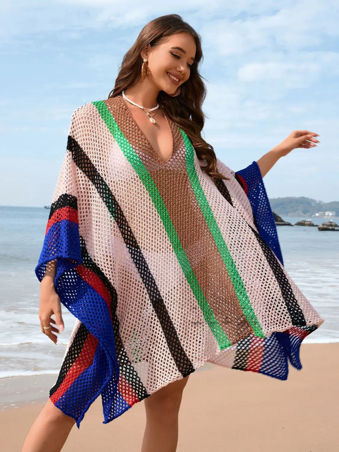 A vibrant open-front loose plus size bikini blouse made of mesh with bold vertical stripes in green black blue and red.