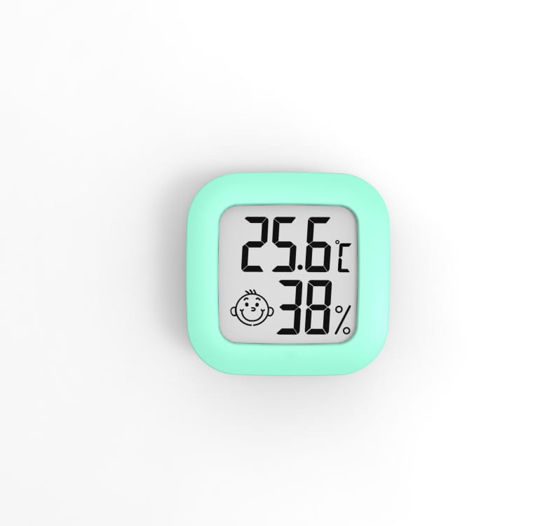 A mint green digital display temperature and humidity meter with an electronic digital display showing 25.6°c and 38 percent humidity alongside a smiling face icon.