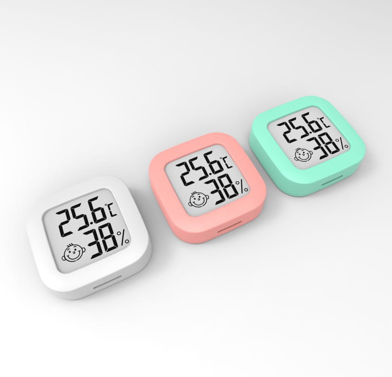 three square-shaped electronic digital display thermometers and hygrometers in white pink and mint green with rounded edges for digital display temperature and humidity measurement.