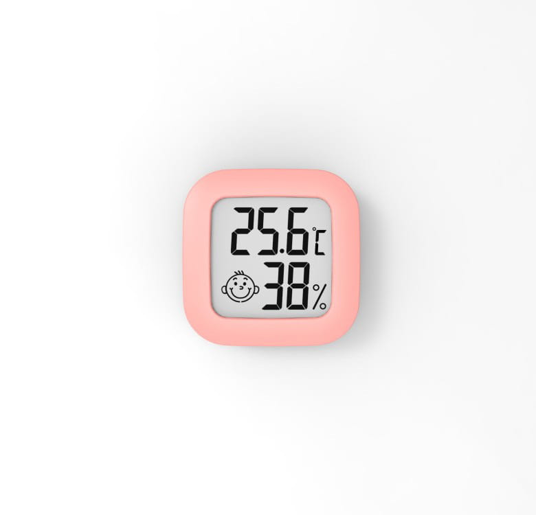 Pink square electronic digital display thermometer and hygrometer featuring a smiling baby face icon for accurate digital display temperature and humidity measurement.