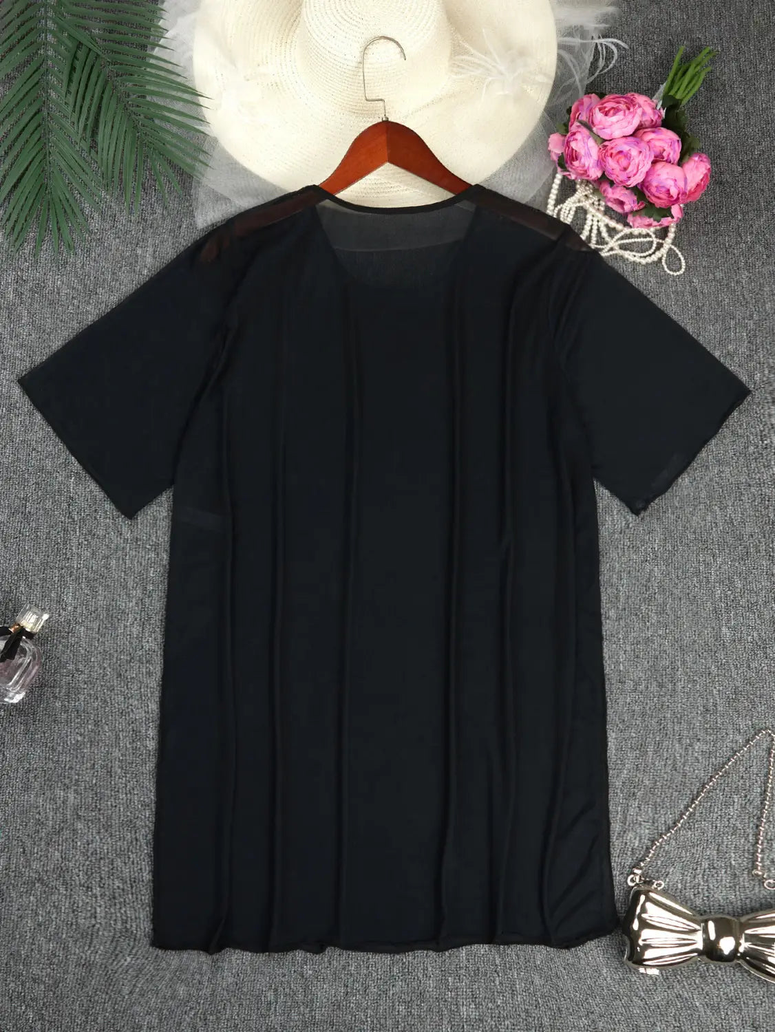 plus size blouse bikini cover up in black pleated fabric with sheer mesh back and shoulder panels showing the back side of the blouse bikini swimsuit.