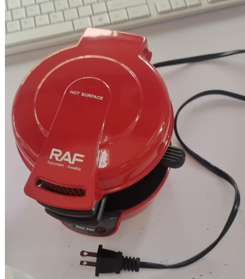 Red circular electric hamburger maker and egg toaster with raf equipment - goodlife branding and black power cord designed for royale essence lux use.