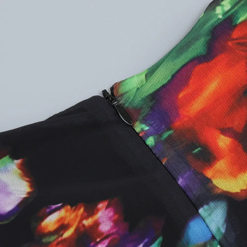 black dress with vibrant abstract floral print in orange green purple and blue hues featuring a v-neck split comfort design ideal for casual dress wear