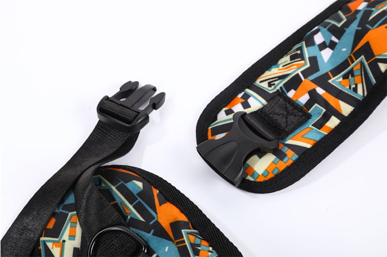 Black mesh carrying pets bag for women featuring a vibrant geometric-patterned shoulder strap with bold orange teal and black abstract design on a durable fabric base ideal for outdoor use.