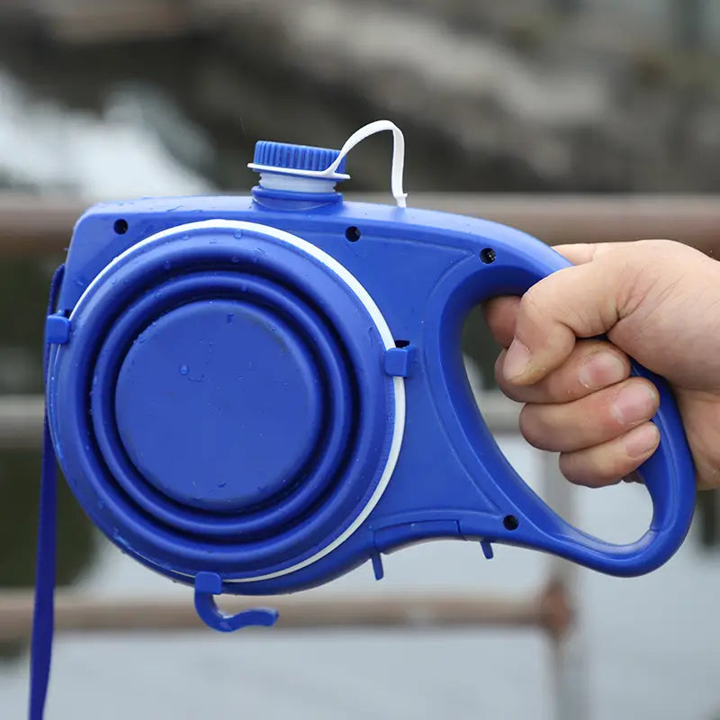 Blue plastic retractable dog leash with built-in water bottle cap and white accent trim designed as pet supplies with pet rope for convenient hydration and walking.