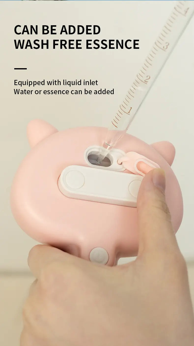 pink cat-shaped portable spray bottle with a white liquid inlet and cap designed for a self-cleaning mist grooming brush for cats and dogs.