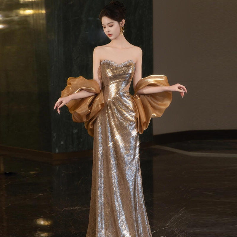 a gold sequined banquet temperament evening dress featuring a fitted bodice and voluminous satin sleeves in a shimmering fabric