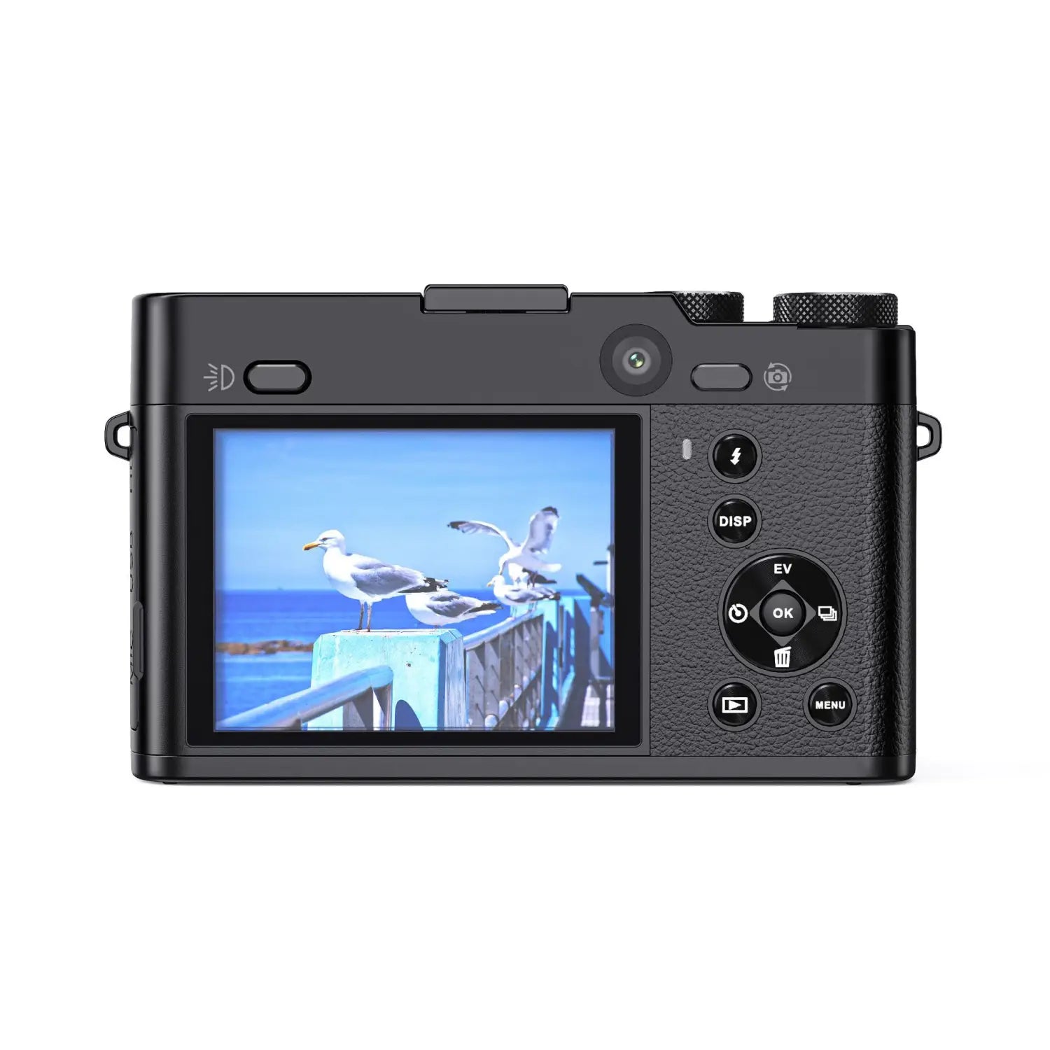 black textured digital camera body with rear lcd screen displaying seagulls on a pier featuring 3x optical zoom royale essence lux model