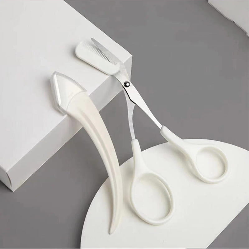 white plastic eyebrow trimmer with a curved handle and integrated comb included in the pink eyebrow trimming knife and scissors set for precise eyebrow trimming.