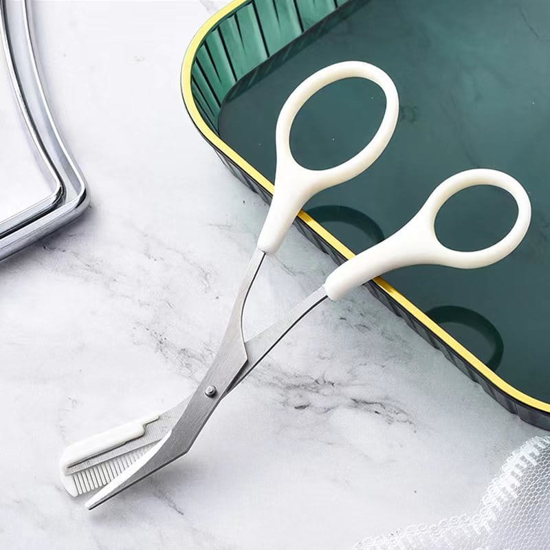Pink eyebrow trimming knife and scissors set featuring white-handled pet grooming scissors with stainless steel blades and a comb attachment for precise eyebrow trimmer use.