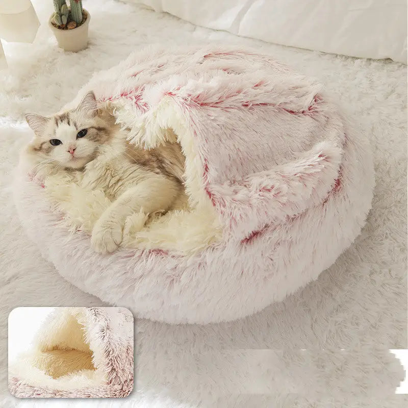 pink round plush warm cat bed pet featuring fluffy pink and white faux fur and a cozy rounded design for comfort