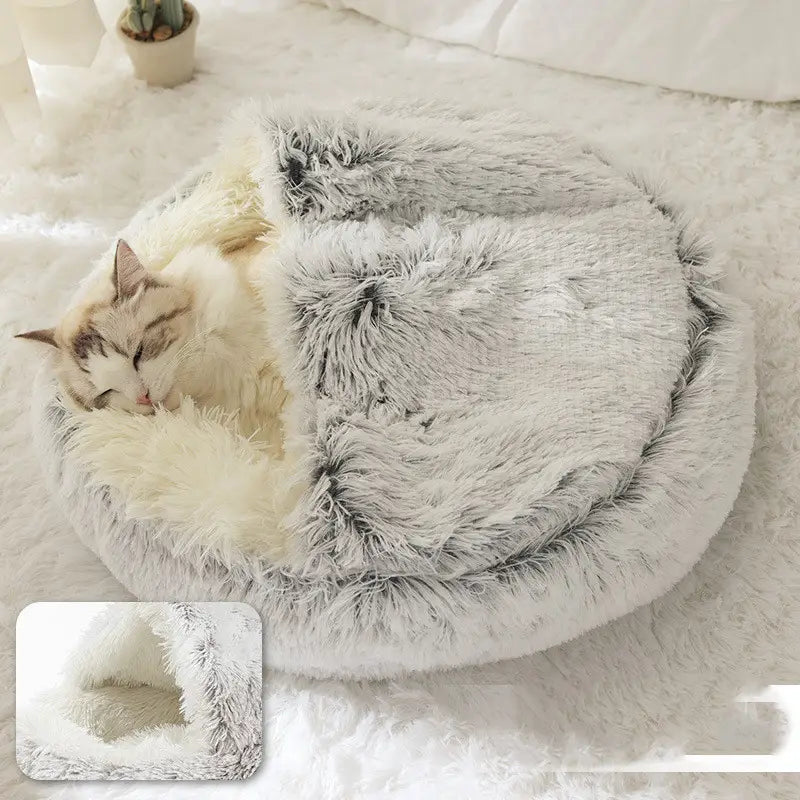 fluffy round plush warm cat bed pet with soft gray and white faux fur exterior and plush interior for comfortable resting.
