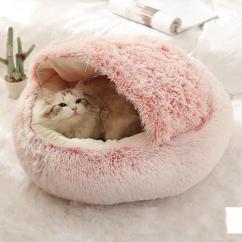 Pink round plush warm cat bed pet with a soft fluffy pink exterior and white plush interior lining for comfortable bed pet use.