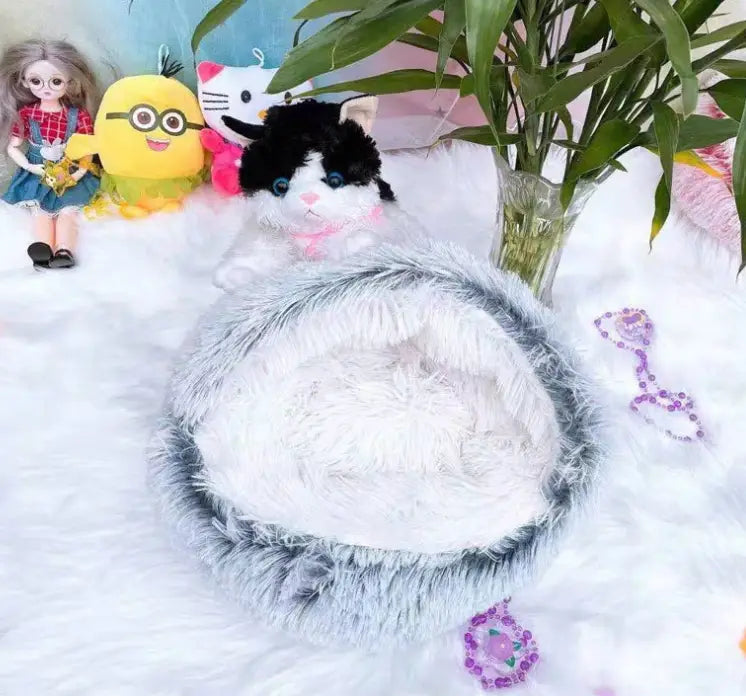 fluffy gray and white faux fur cat bed pet with a soft rounded design in a pink round plush warm style for comfortable use