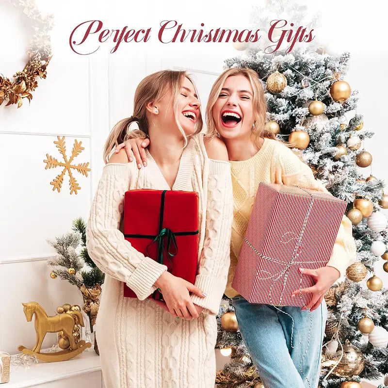 red gift box with black ribbon and green bow next to a pink kiss stainless steel handle straw insulated tumbler designed for stainless steel spill prevention