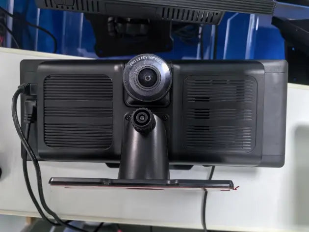 black rearview camera with circular lens and textured housing mounted on a stand for 10.26 inch car navigation with rear dual recording feature