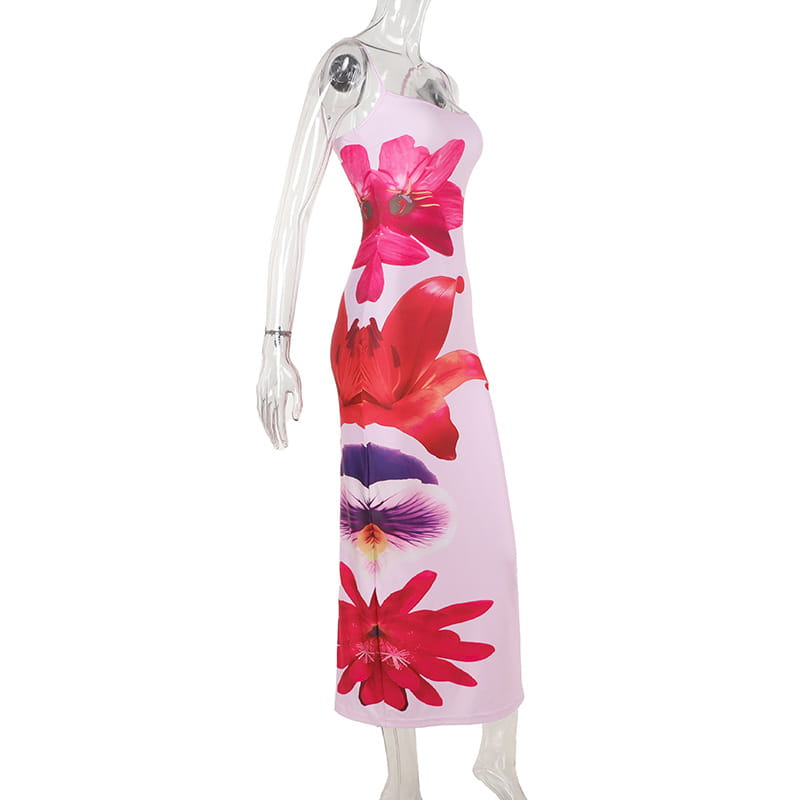 A pink strapless midi flower strap dress featuring an american style flower print with bold red and purple blossoms.