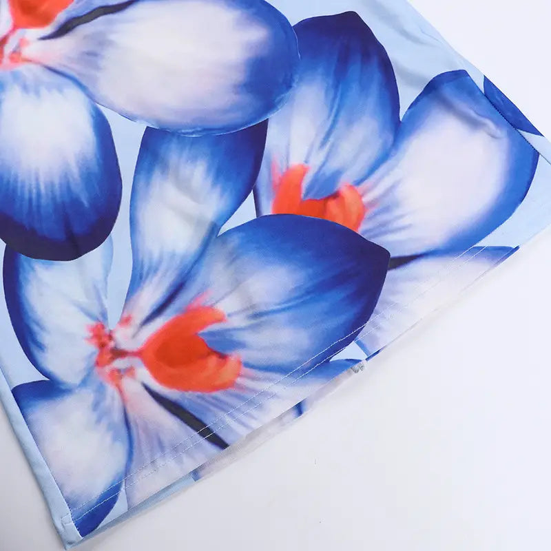pink floral american style flower strap dress made of blue and orange floral printed fabric with a soft slightly textured surface