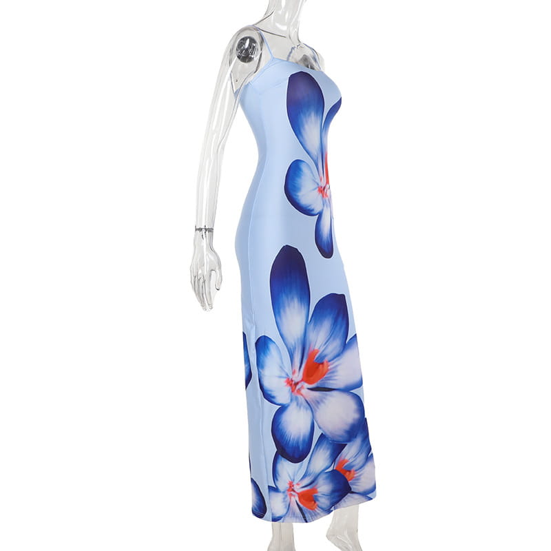 a light blue sleeveless maxi flower strap dress with flowing fabric featuring large vibrant blue american style flower accents with orange centers