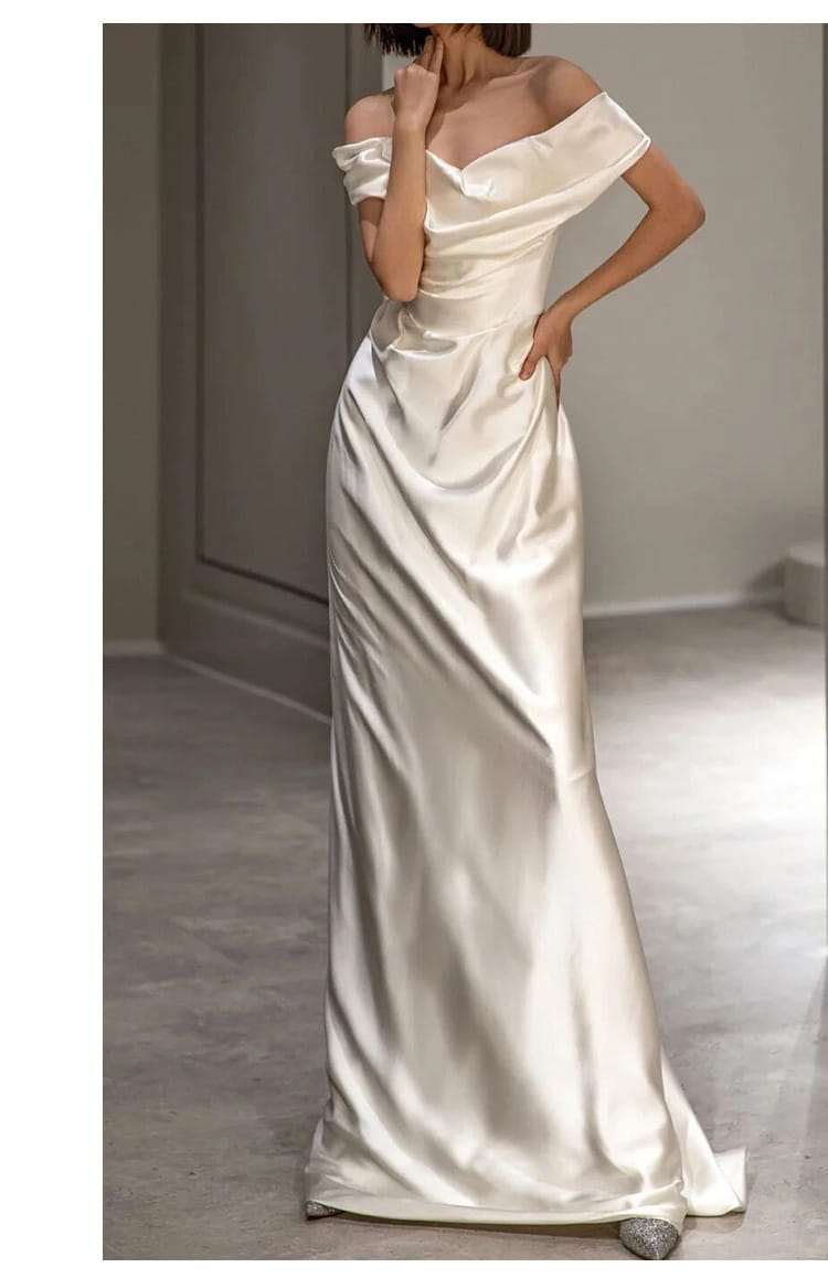 French white off-shoulder satin wedding dress in a soft ivory hue featuring elegant draping and a sleek silhouette perfect as a light wedding dress.