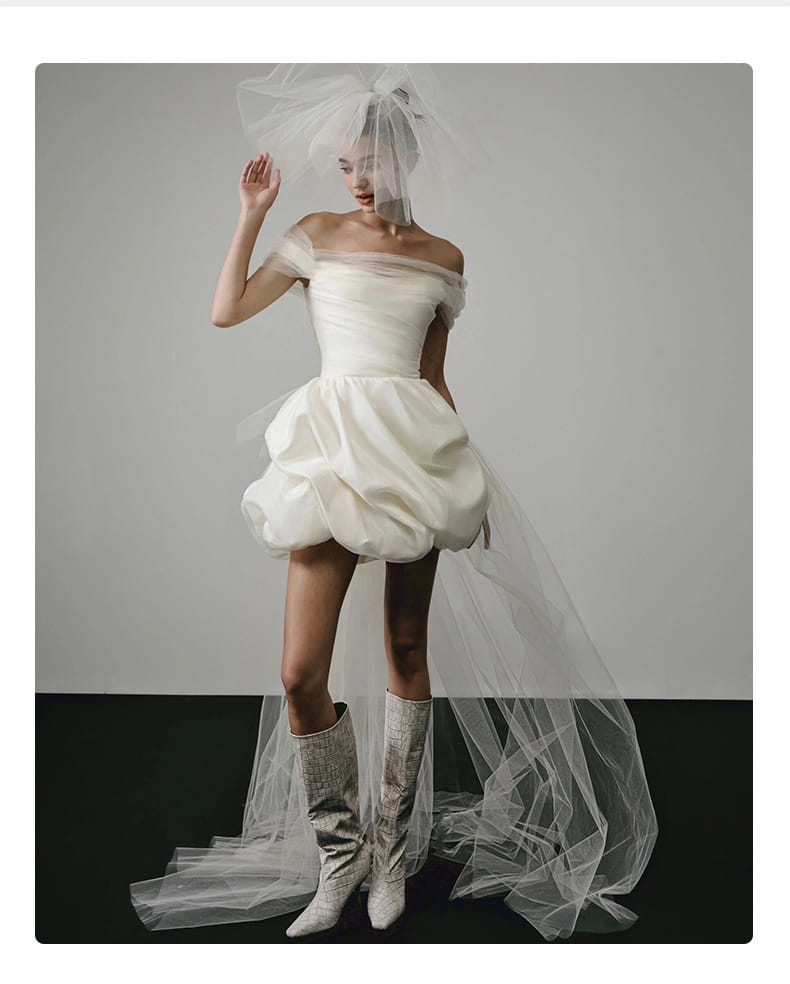 white off-the-shoulder satin mini wedding dress with voluminous skirt and sheer veil is a light wedding dress white perfect for elegant ceremonies