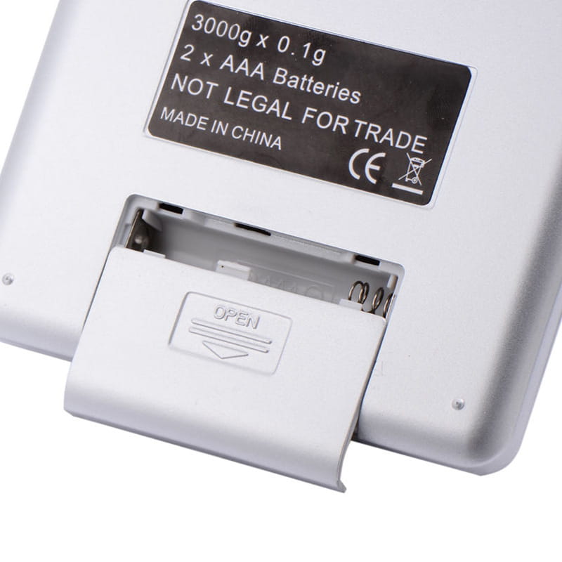 white plastic digital household food portable scale with black label indicating 3000g capacity and two aaa batteries for brushed stainless steel food portable mini pocket scale