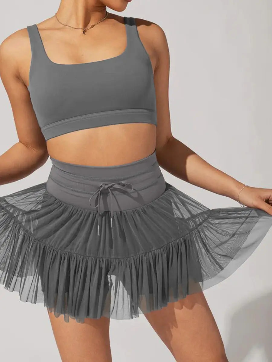 gray mesh pleated skirt with high waist elastic band and tied bow detail designed as safety pants summer option