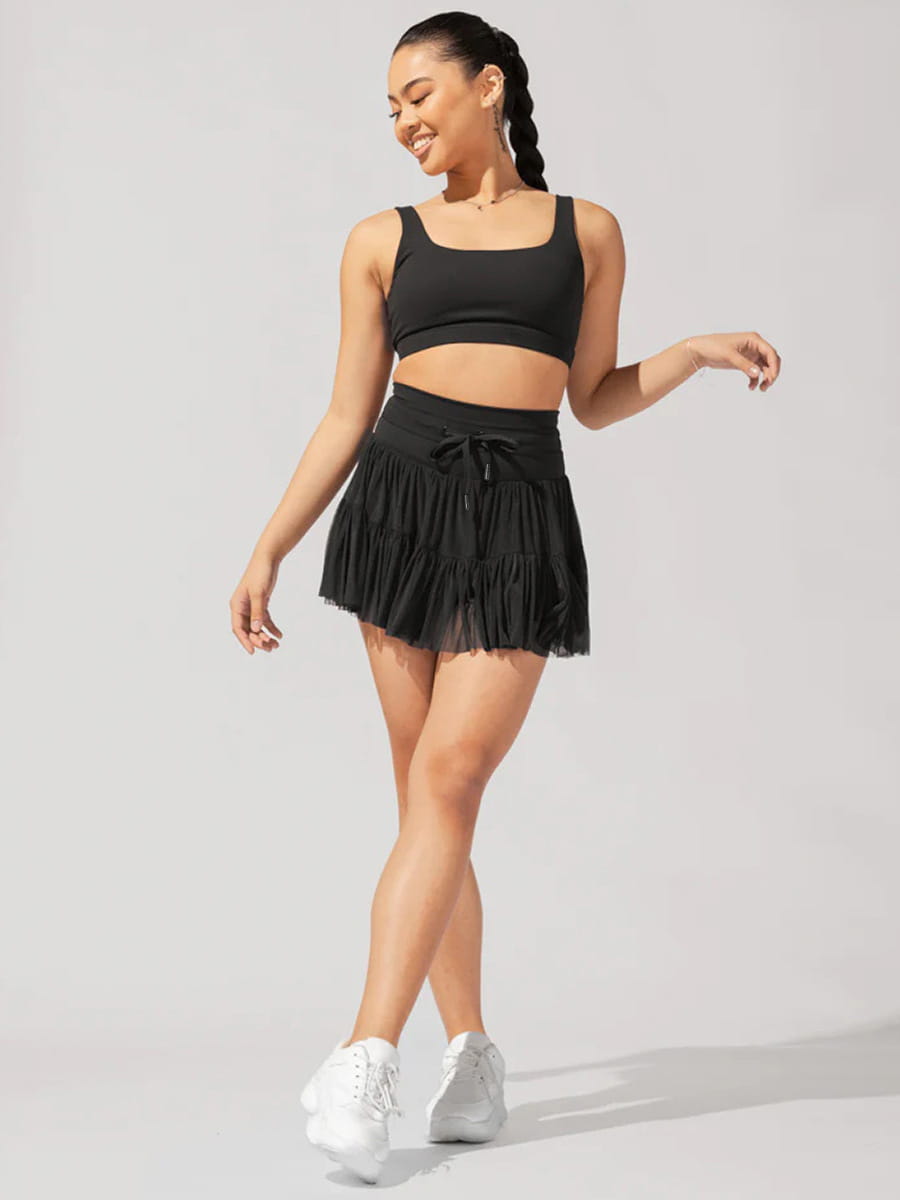 black tiered pleated skirt with drawstring waistband suitable as a high waist dress alternative with integrated safety pants for summer use