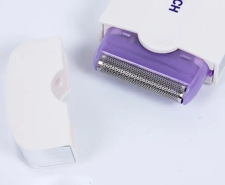 Purple electric hair removal device with sensa-light head featuring a metallic mesh and white plastic casing partially visible in its packaging.