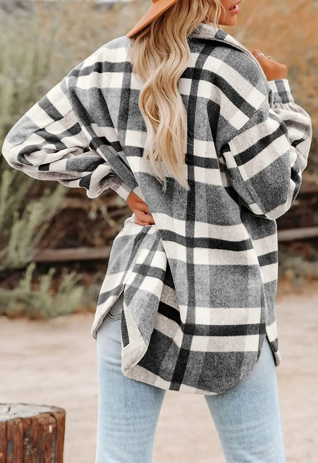 A cozy oversized plaid button flannel woolen shirt in a classic black and white pattern with soft gray accents.