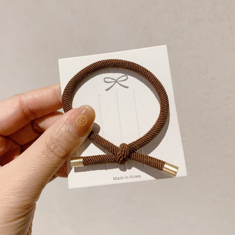 Brown braided wrist hair rope with gold-colored metal ends featuring high elasticity for secure hair styling in a 5 pack set.
