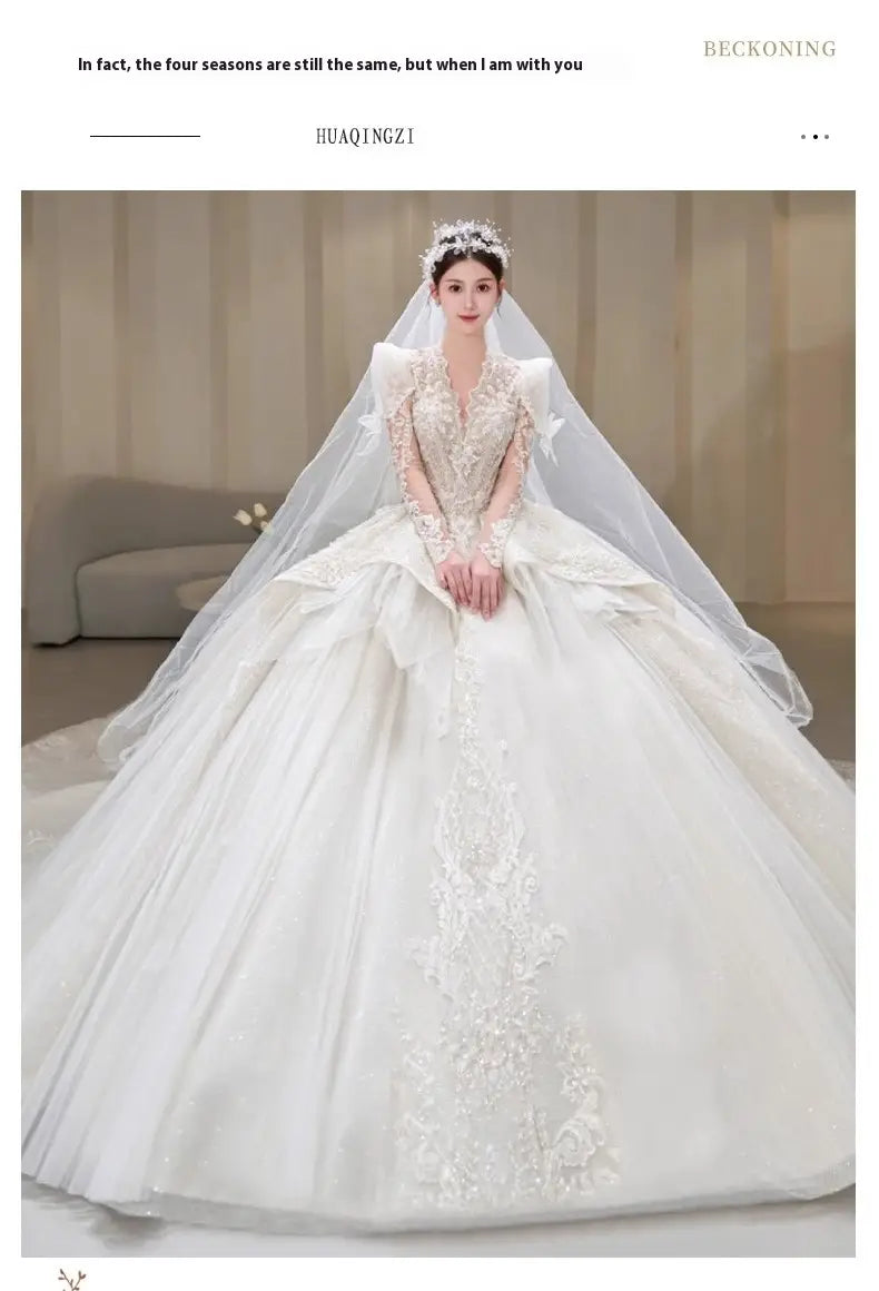 a voluminous white bride main yarn wedding gown featuring intricate lace and beaded floral embroidery with main yarn long sleeves designed for elegant bridal wear