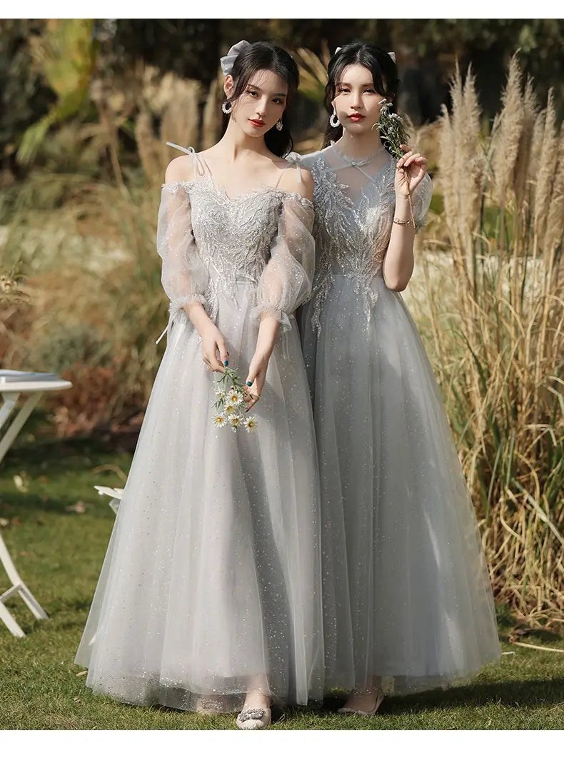 Elegant silver gray tulle sisters dress female featuring intricate beaded detailing and sheer puffy sleeves in a ballgown design.