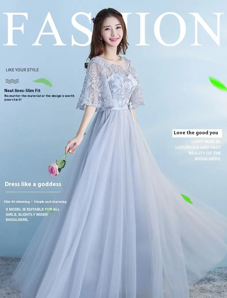 A long bridesmaid blue lace and tulle dress with sheer short sleeves and a fitted bodice suitable for a bridesmaid blue wedding.